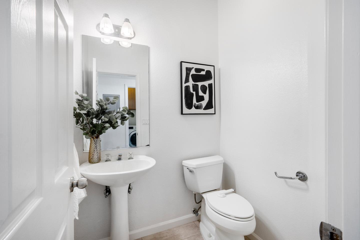 581 Eden Street Gilroy, CA 95020 - Photo 25 of 40 a bathroom with a toilet sink and mirror