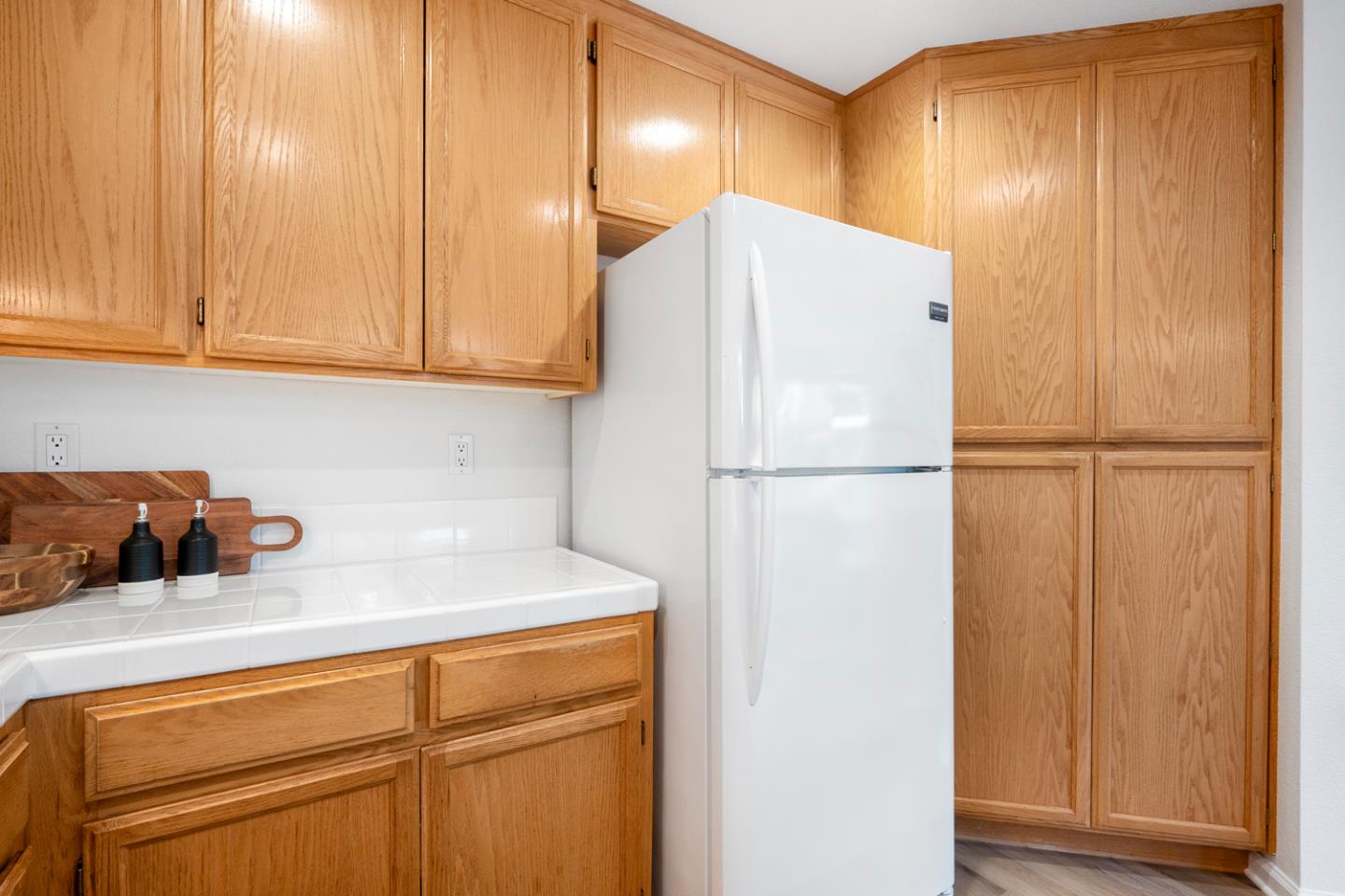 581 Eden Street Gilroy, CA 95020 - Photo 10 of 40 a kitchen with a refrigerator and cabinets
