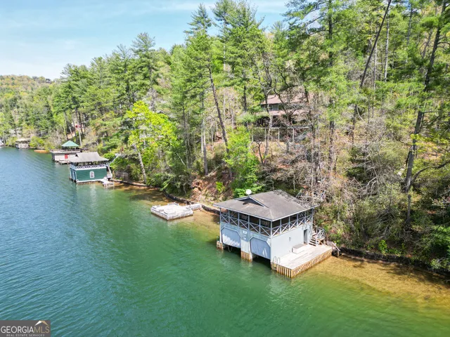 a view of a house with a yard and balcony
