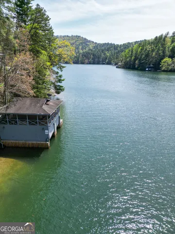 a view of walk in closet with wooden floor