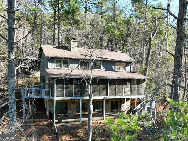 a kitchen with granite countertop sink and windows