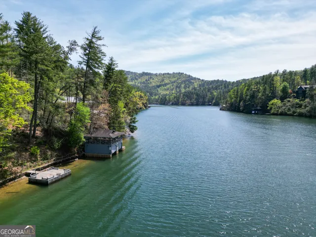 a view of a wooden deck with a yard