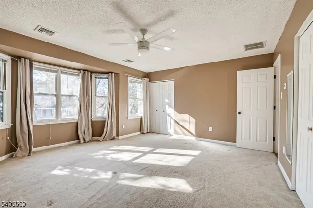 a bathroom with a sink mirror toilet and shower