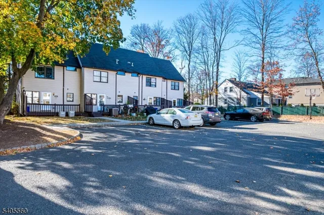 a view of street with parked cars
