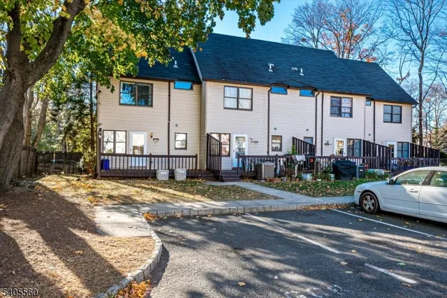 a view of a car parked in front of a house
