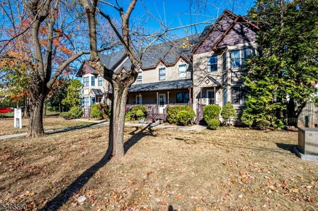 a view of a balcony with wooden floor and fence
