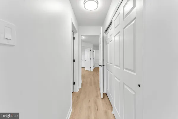 a view of a hallway with a white walls