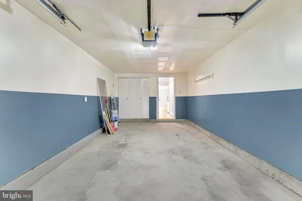 a view of empty room with ceiling fan