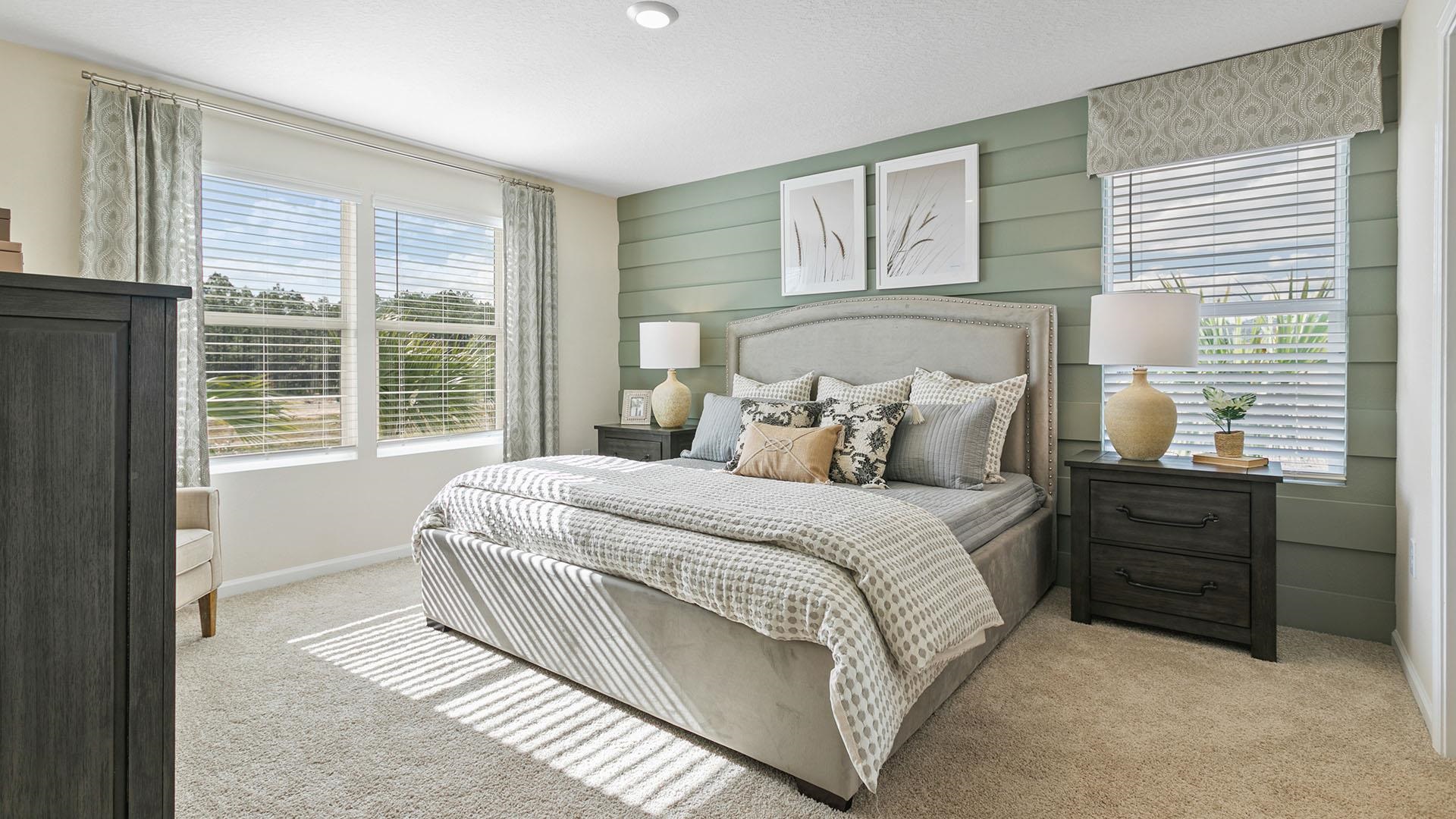 302 Redbud Road Palm Coast, FL 32137 - Photo 15 of 39 a bedroom with a bed and a large window
