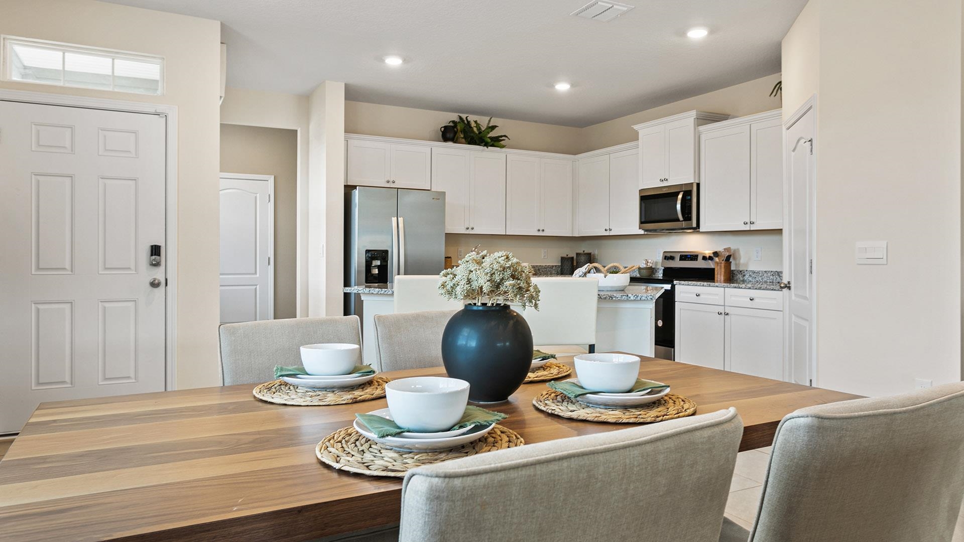 302 Redbud Road Palm Coast, FL 32137 - Photo 9 of 39 a kitchen with a sink a stove and cabinets