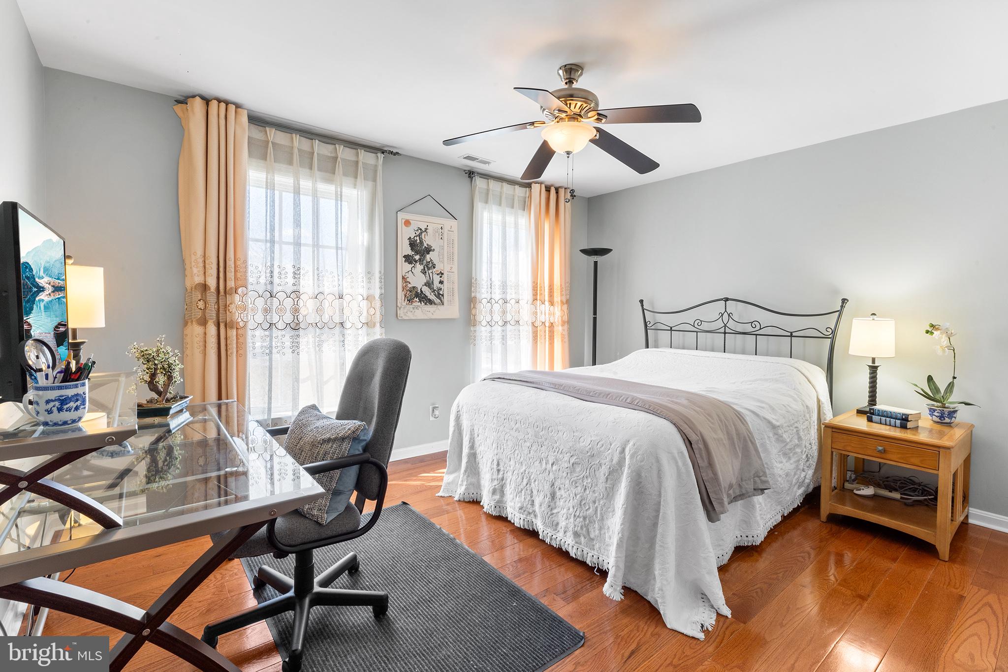 72 Hollow Drive Malvern, PA 19355 - Photo 28 of 63 a bedroom with a bed a desk and chair with windows
