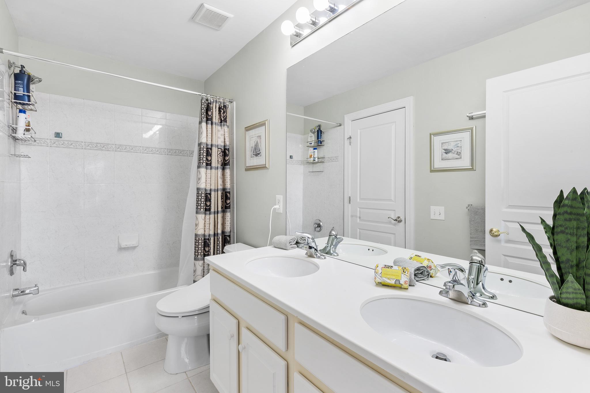 72 Hollow Drive Malvern, PA 19355 - Photo 29 of 63 a bathroom with a sink a toilet and shower