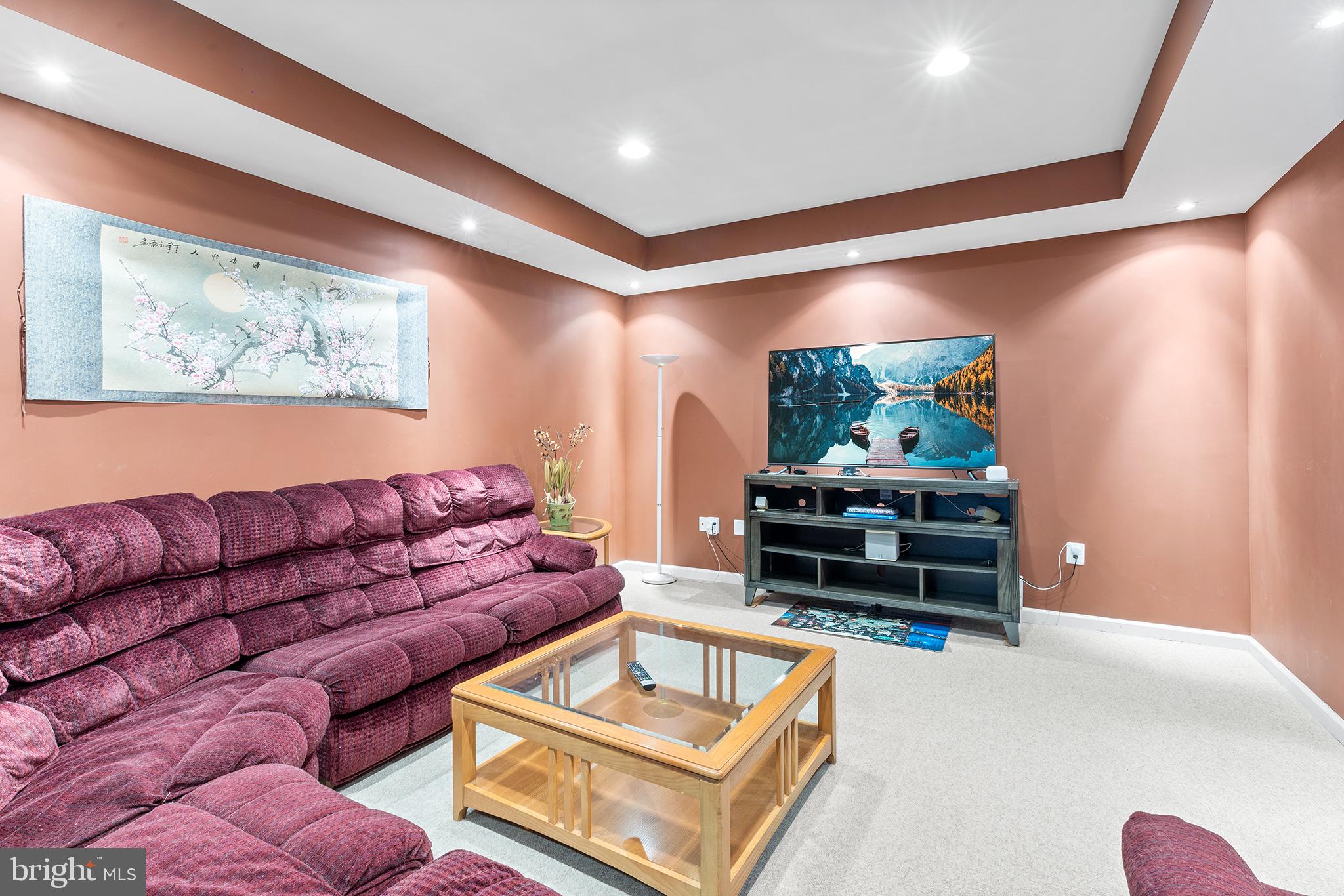 72 Hollow Drive Malvern, PA 19355 - Photo 36 of 63 a living room with furniture and a flat screen tv