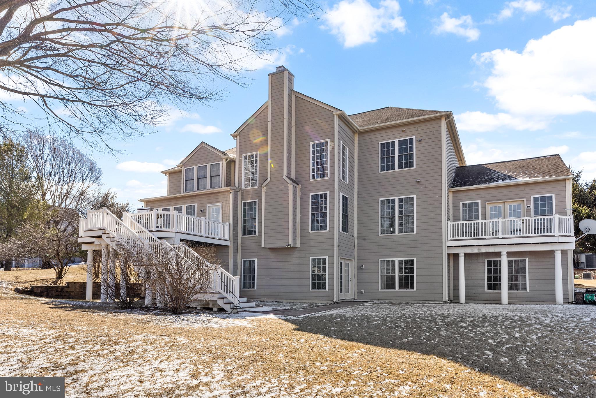 72 Hollow Drive Malvern, PA 19355 - Photo 38 of 63 a view of a blue house with a yard covered in snow
