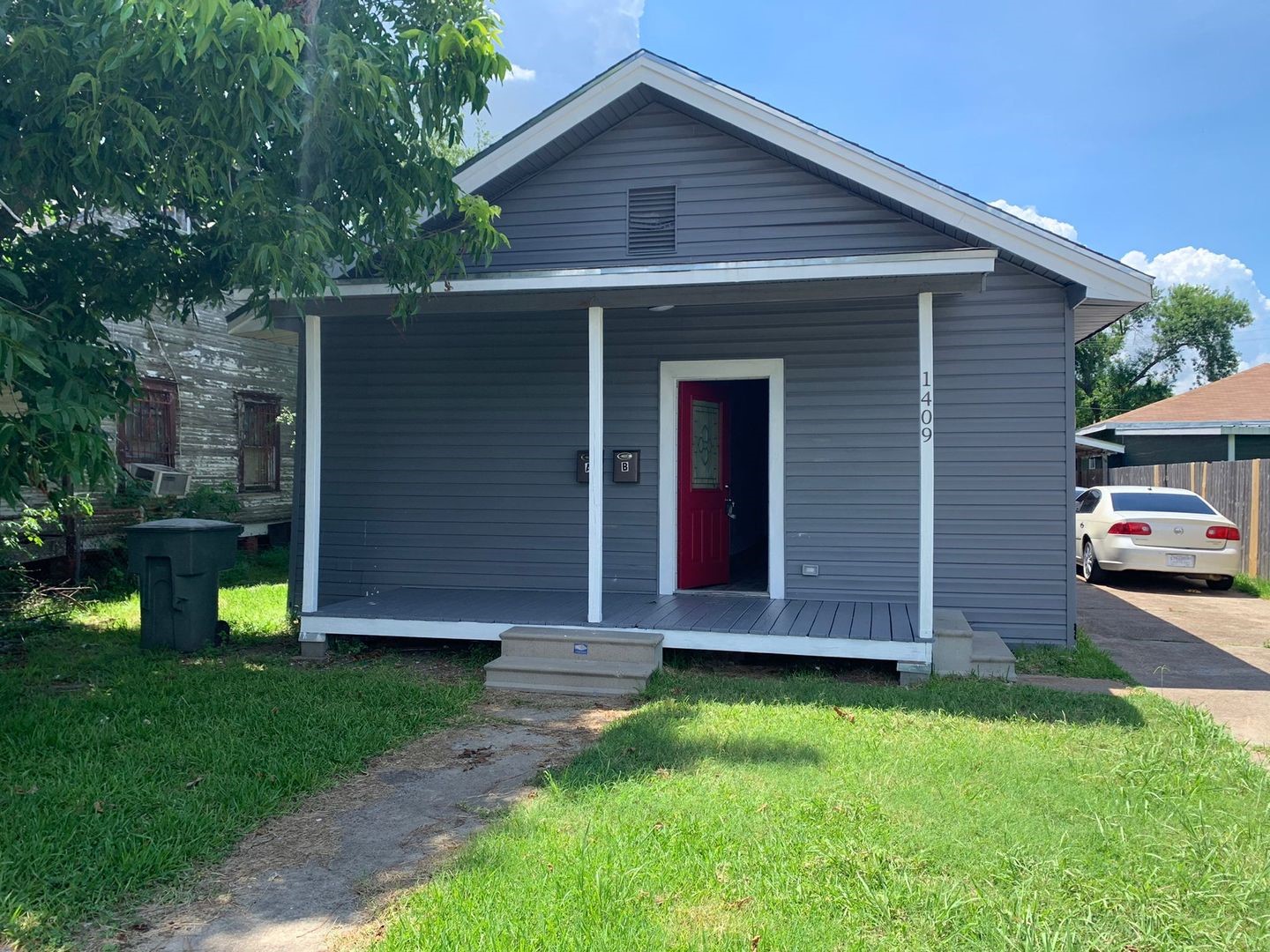 1409 10th Street Port Arthur, TX 77640 - Photo 1 of 11 a front view of house with a garden