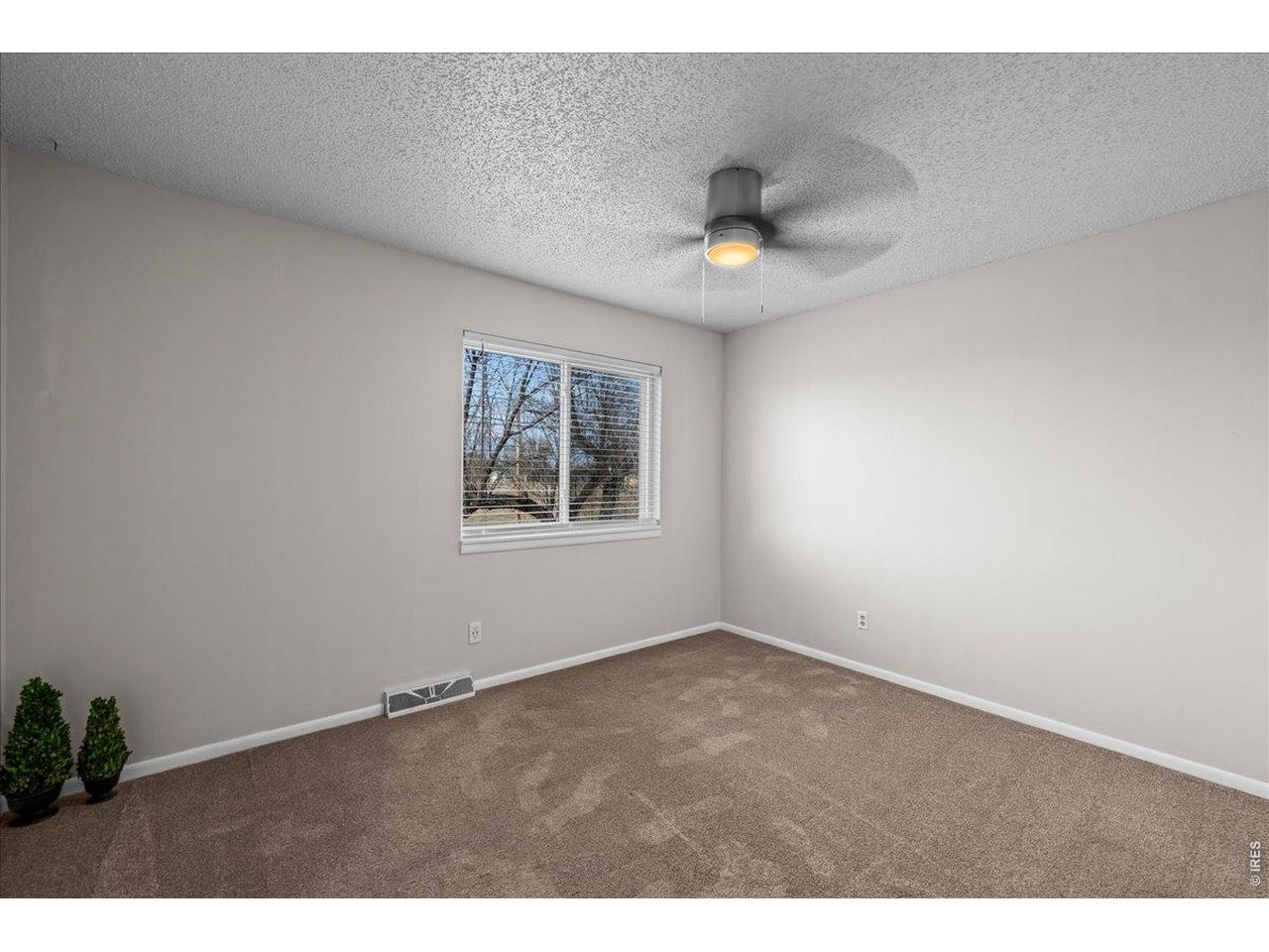 516 West Main Street Pierce, CO 80650 - Photo 11 of 24 a view of an empty room with a window