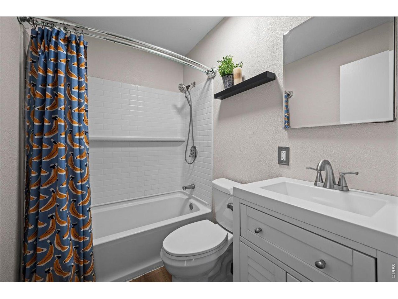 516 West Main Street Pierce, CO 80650 - Photo 12 of 24 a bathroom with a sink toilet a mirror and shower