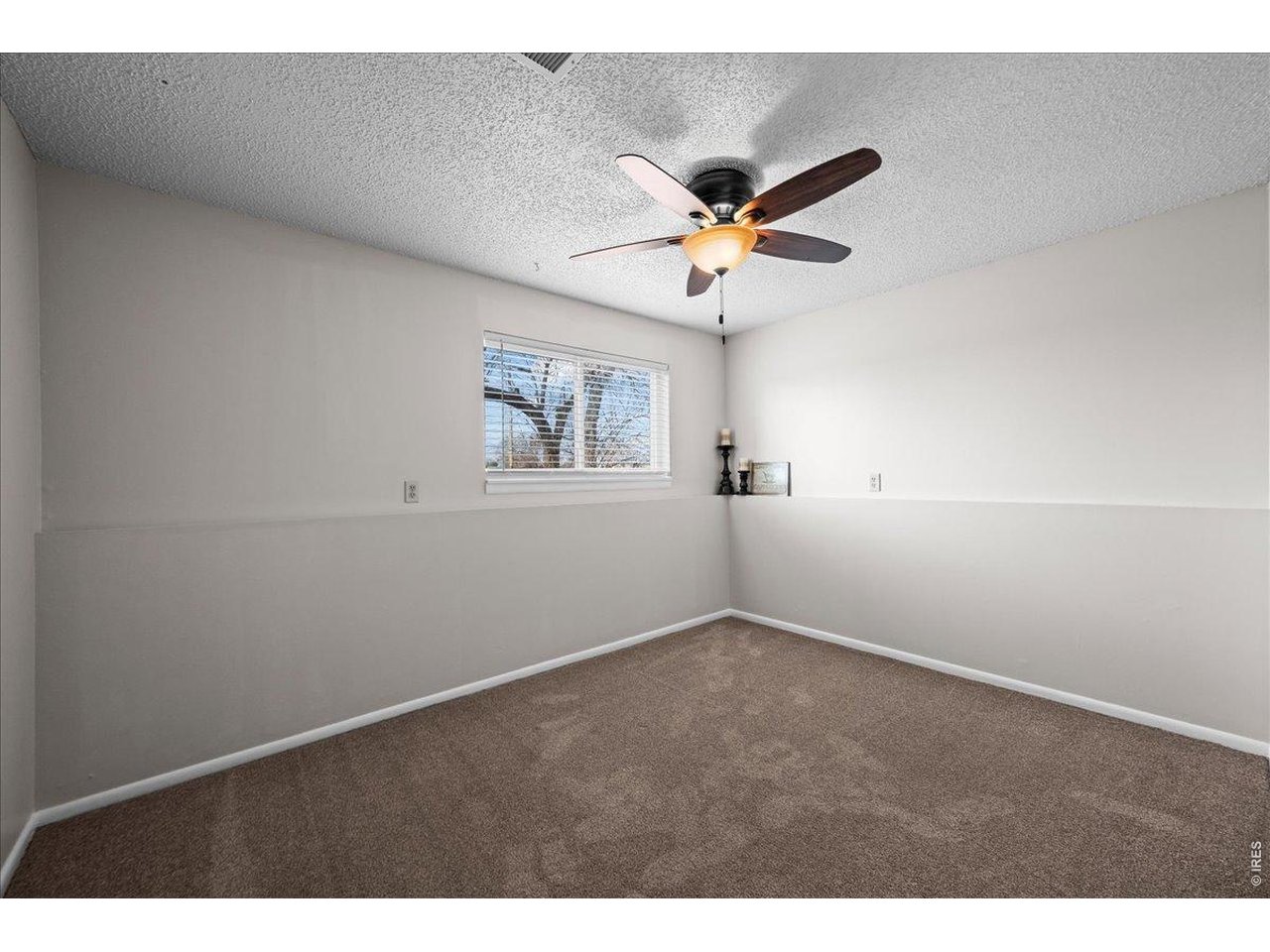 516 West Main Street Pierce, CO 80650 - Photo 16 of 24 a view of an empty room with a window