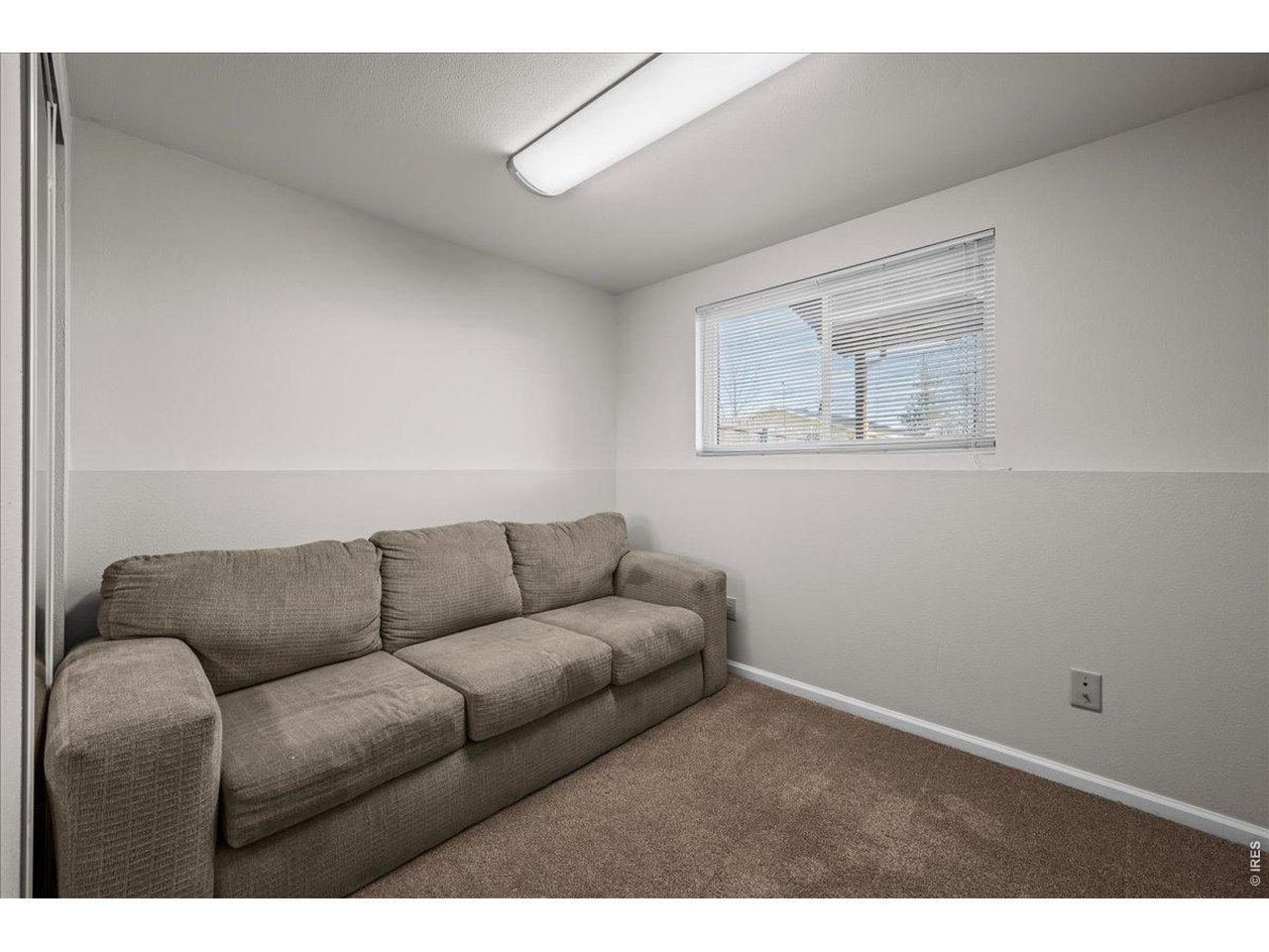 516 West Main Street Pierce, CO 80650 - Photo 19 of 24 a living room with furniture and a couch