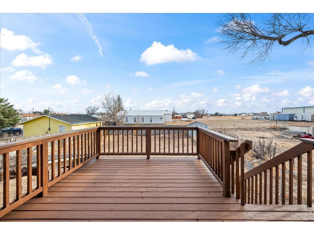 516 West Main Street Pierce, CO 80650 - Photo 6 of 24 a view of a balcony with wooden floor
