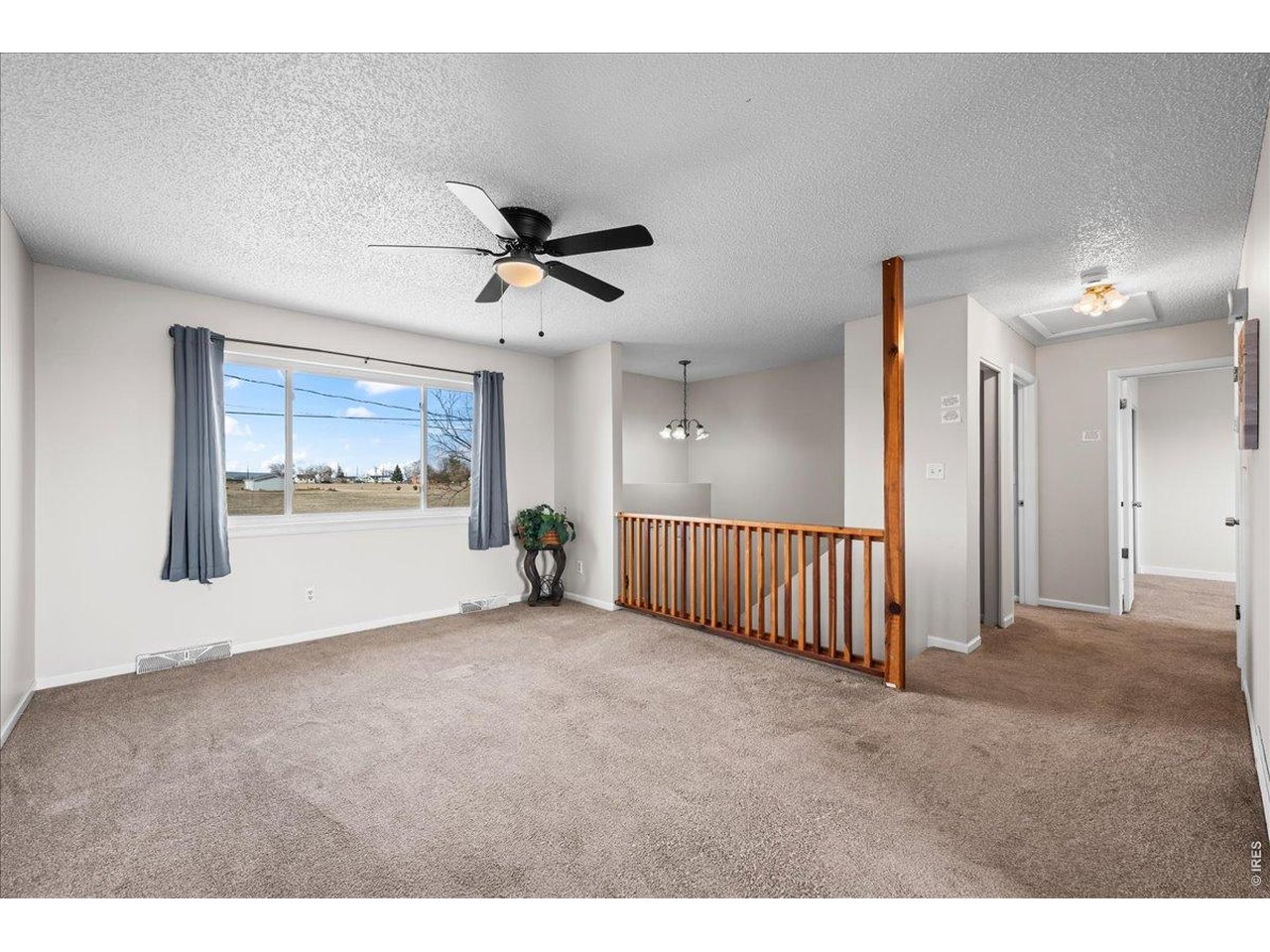 516 West Main Street Pierce, CO 80650 - Photo 9 of 24 a view of an empty room with a window