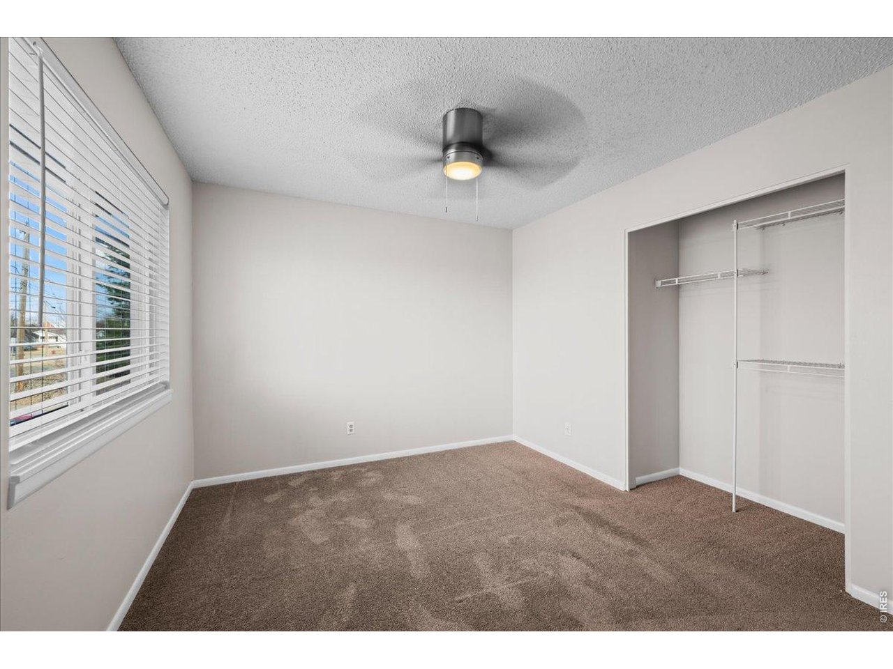 516 West Main Street Pierce, CO 80650 - Photo 10 of 24 a view of an empty room with a window