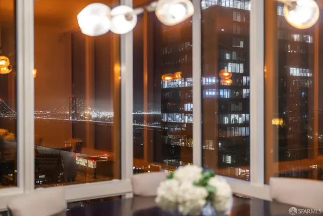 a bathroom with a glass shower door and a mirror