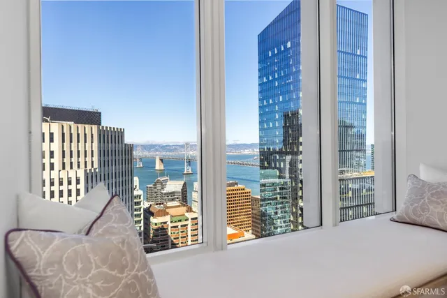 a bathroom with a sink mirror toilet and shower