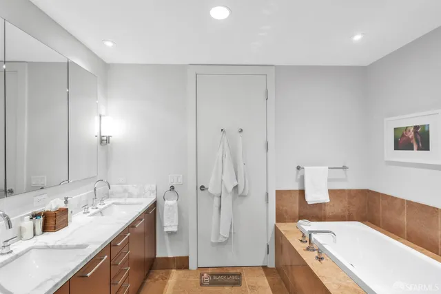 a bedroom with a bed and lamp