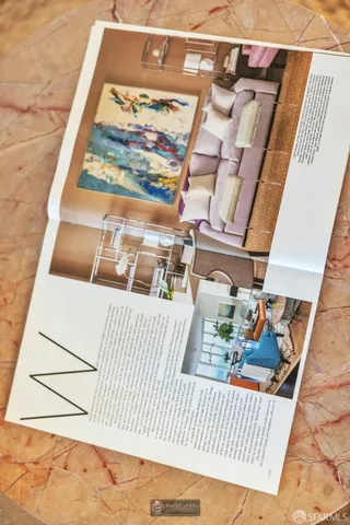 a bedroom with two beds and a large window