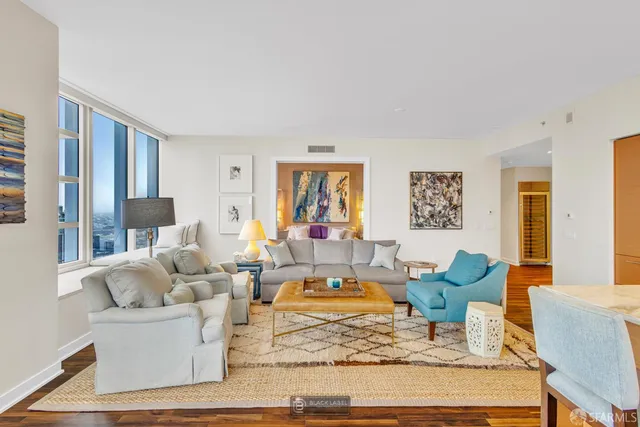 a living room with furniture and a table