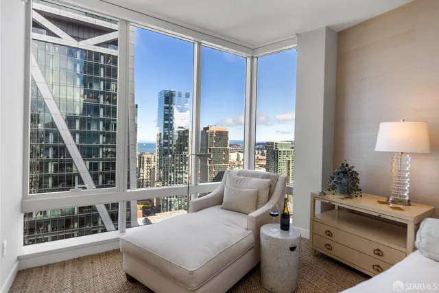 a bedroom with bed and a night stand