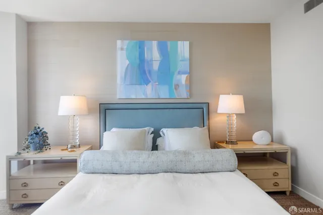 a bathroom with a granite countertop sink toilet a mirror and shower