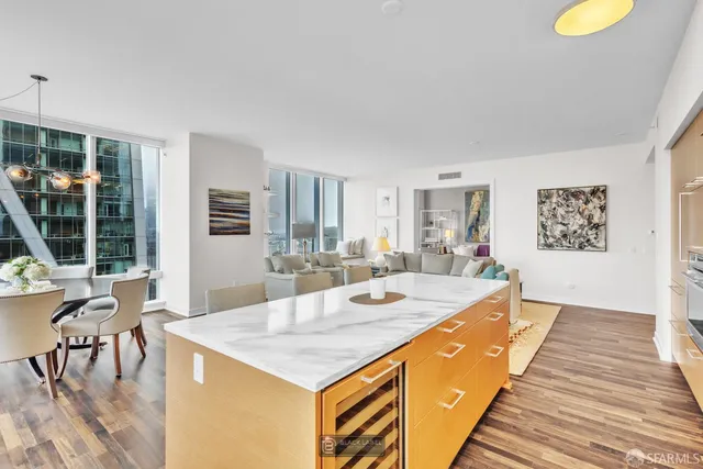 a large living room with stainless steel appliances granite countertop a sink and a dishwasher