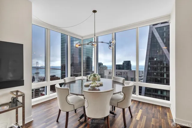 a view of a dining room with furniture window and wooden floor