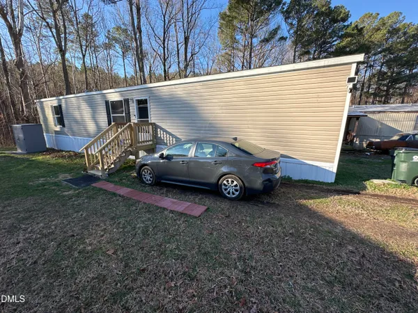 a view of a house with a back yard