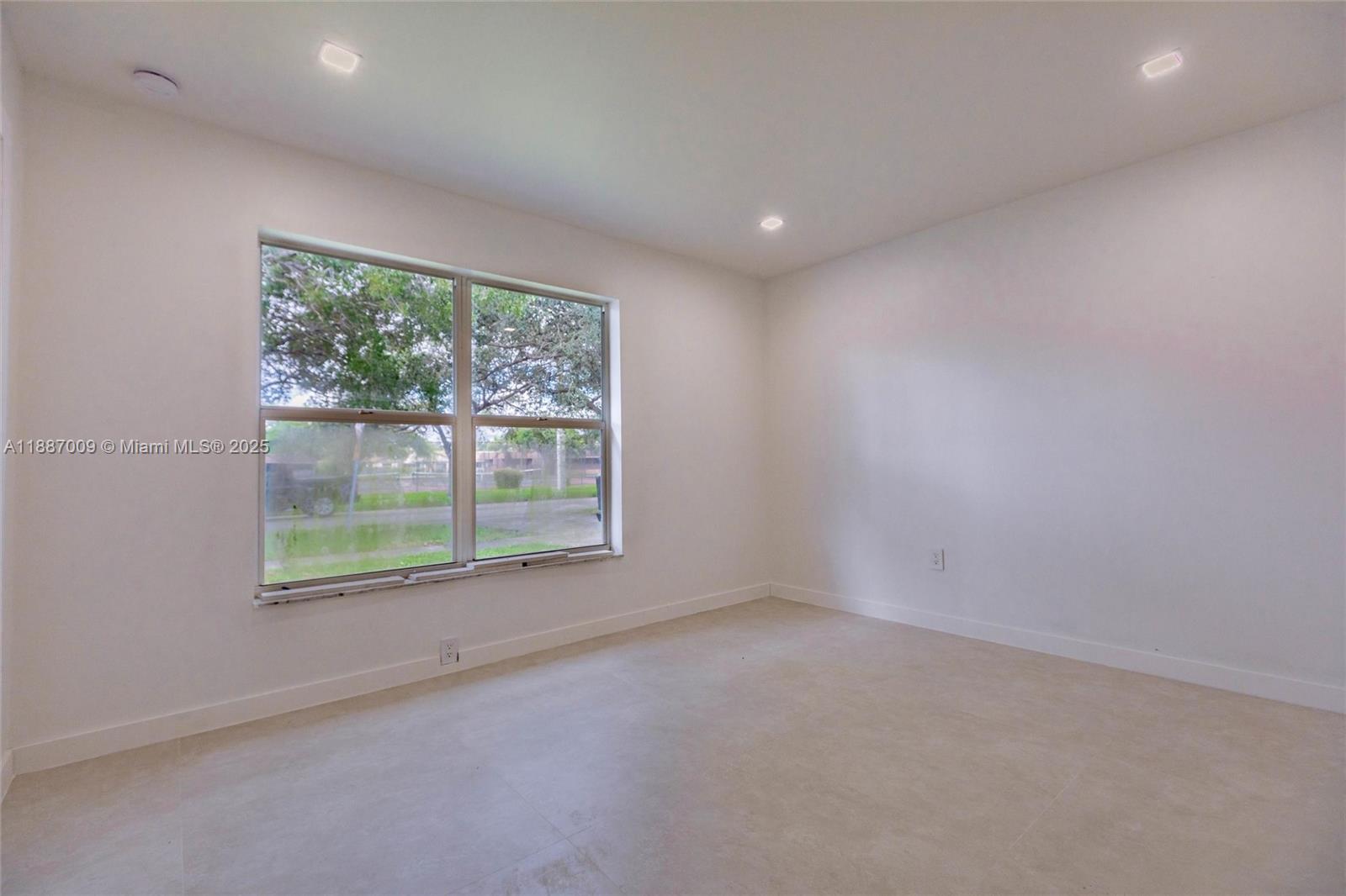 10760 Northwest 29th Manor Sunrise, FL 33322 - Photo 12 of 38 an empty room with windows
