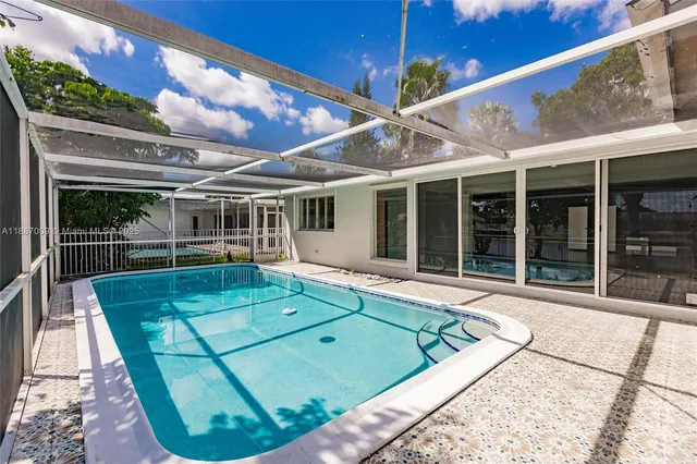 front view of a house with a backyard