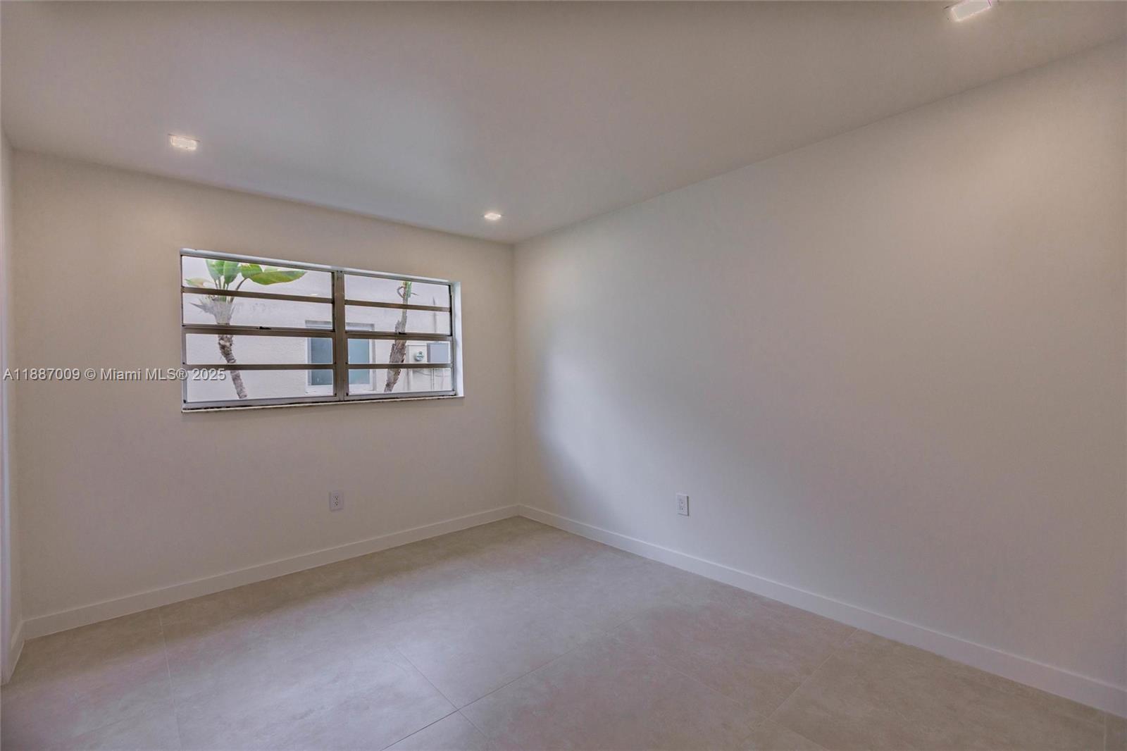 10760 Northwest 29th Manor Sunrise, FL 33322 - Photo 28 of 38 an empty room with windows