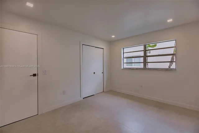 a view of empty room with windows