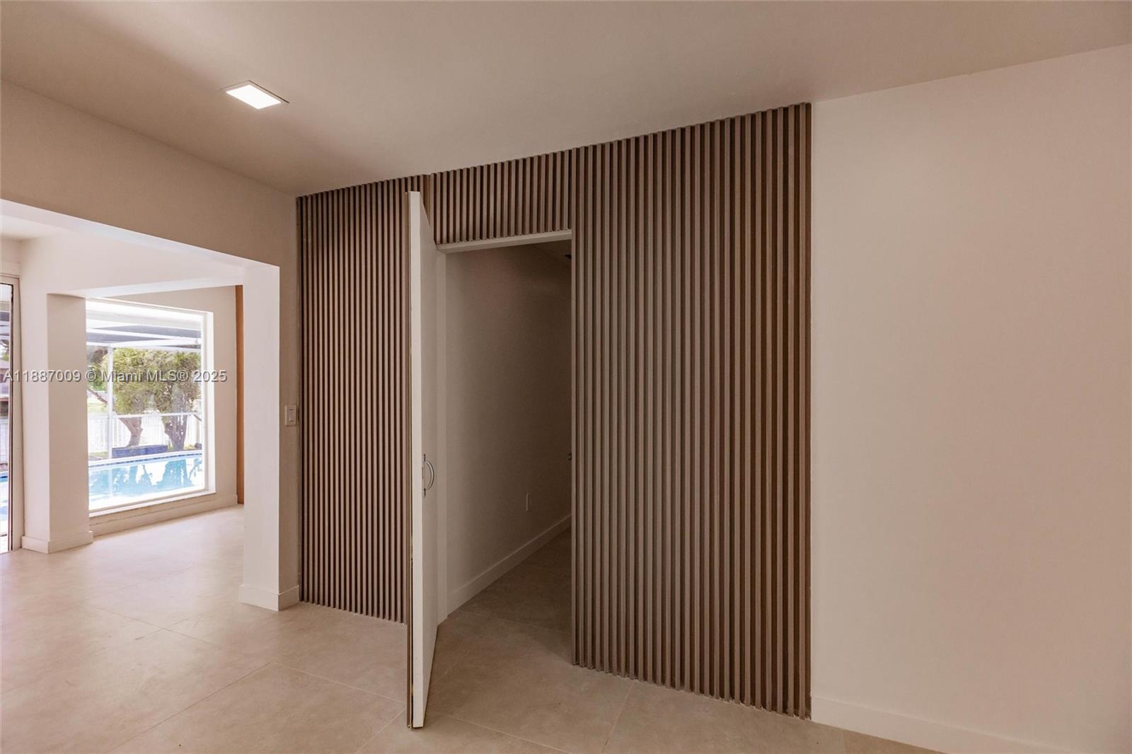 10760 Northwest 29th Manor Sunrise, FL 33322 - Photo 10 of 38 a view of a hallway with wooden floor and windows