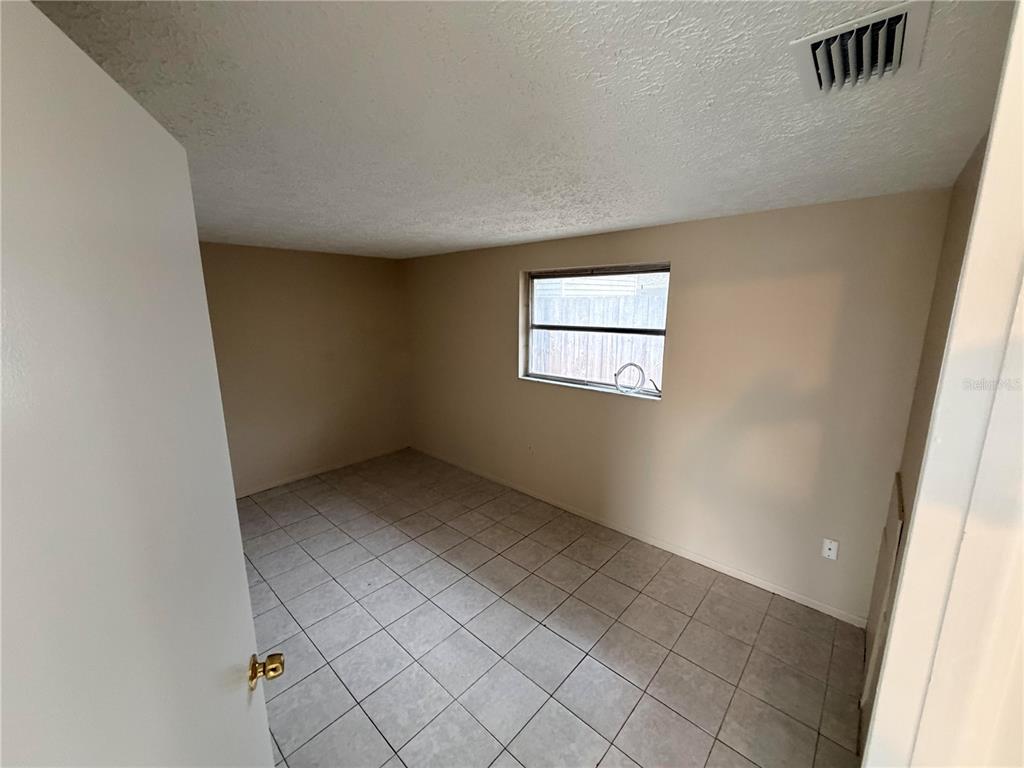 6330 Pennsylvania Avenue New Port Richey, FL 34653 - Photo 14 of 17 an empty room with windows
