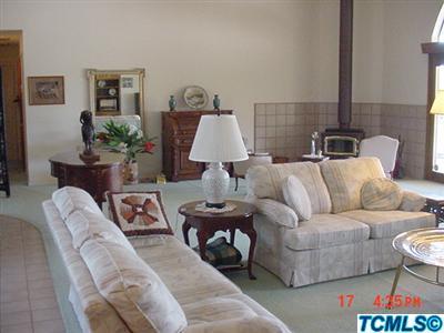 2507 North Filbert Road Exeter, CA 93221 - Photo 8 of 45 WOOD STOVE IN SOARING LIVING ROOM