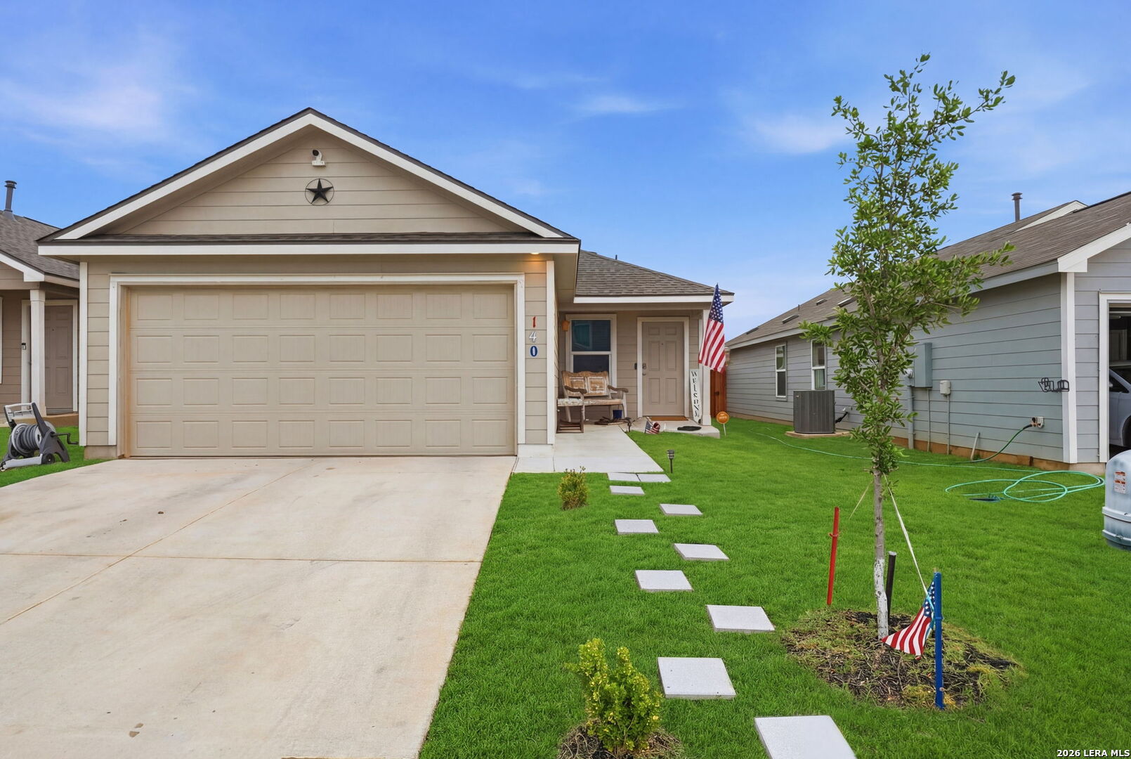 a front view of a house with a yard