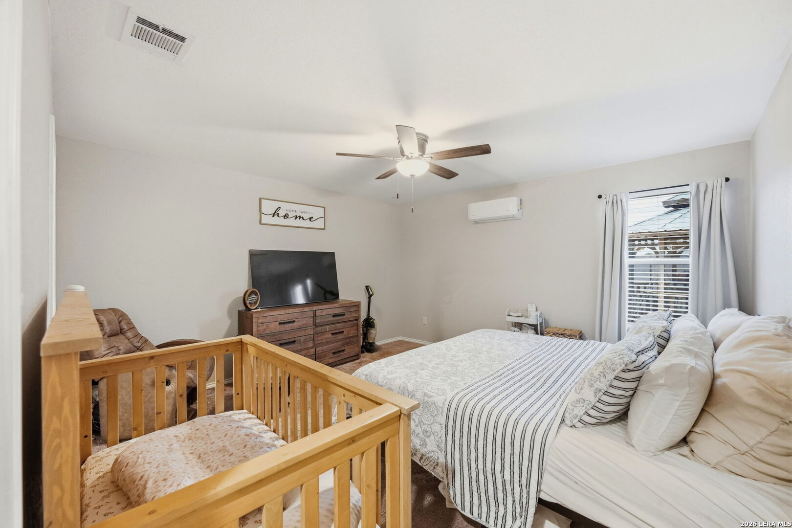 140 Maverick Cove Pleasanton, TX 78064 - Photo 13 of 26 a bedroom with furniture and a window