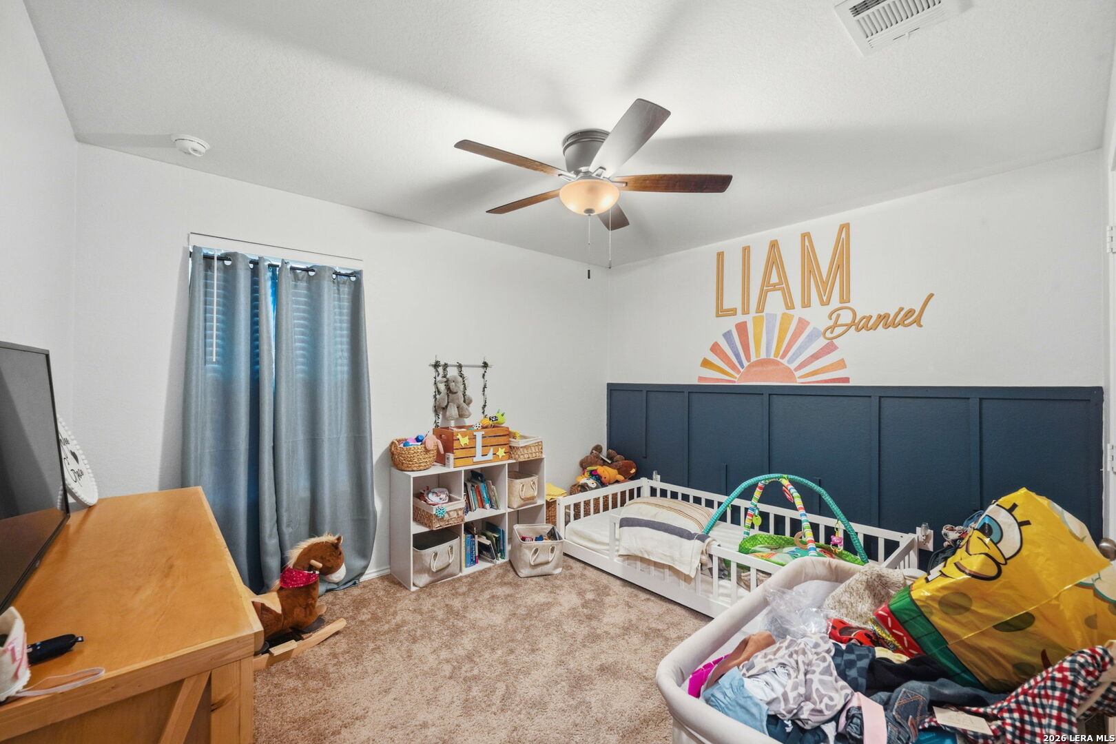 140 Maverick Cove Pleasanton, TX 78064 - Photo 16 of 26 a bedroom with furniture and a chair