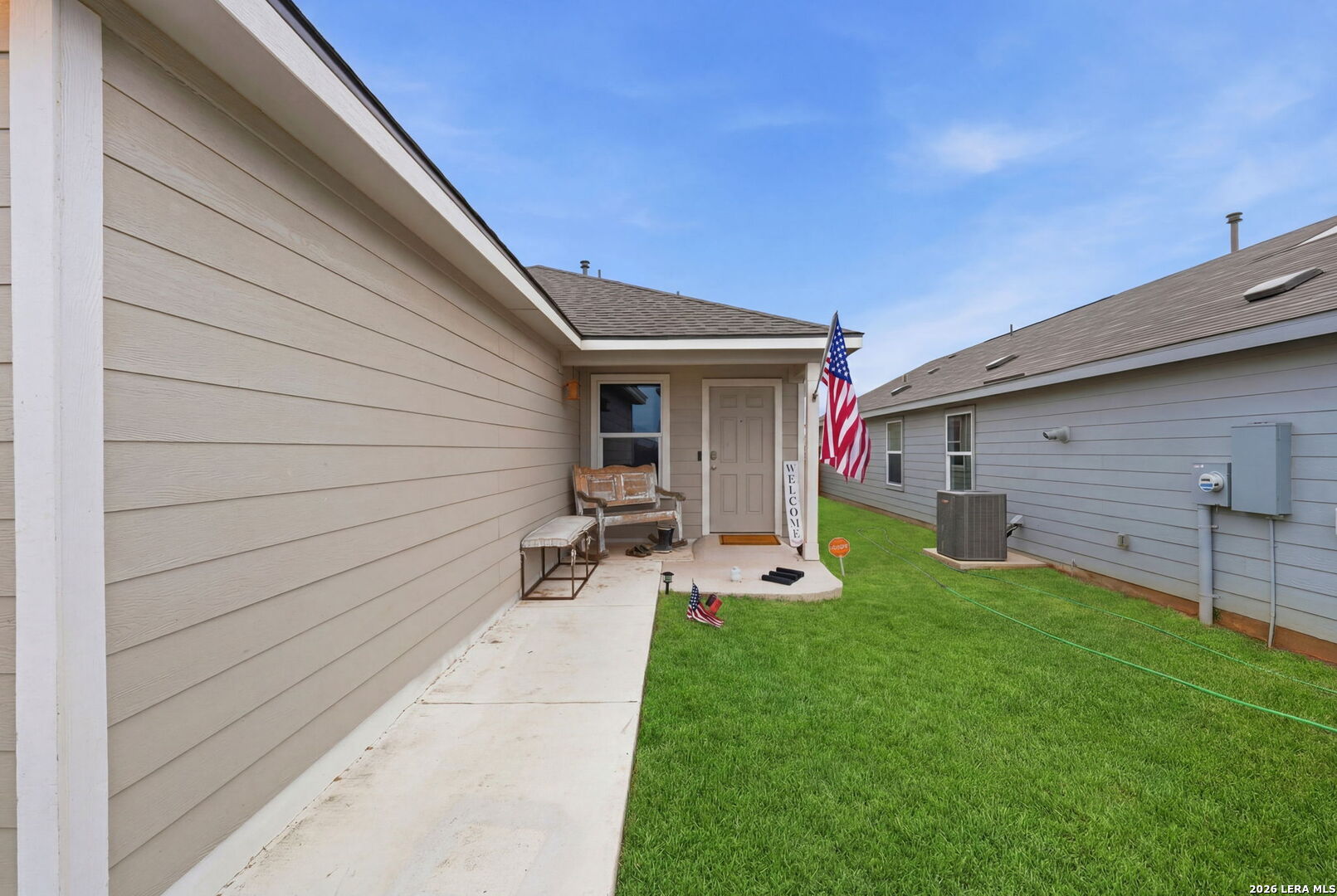 140 Maverick Cove Pleasanton, TX 78064 - Photo 2 of 26 a view of a backyard with table and chairs and wooden fence