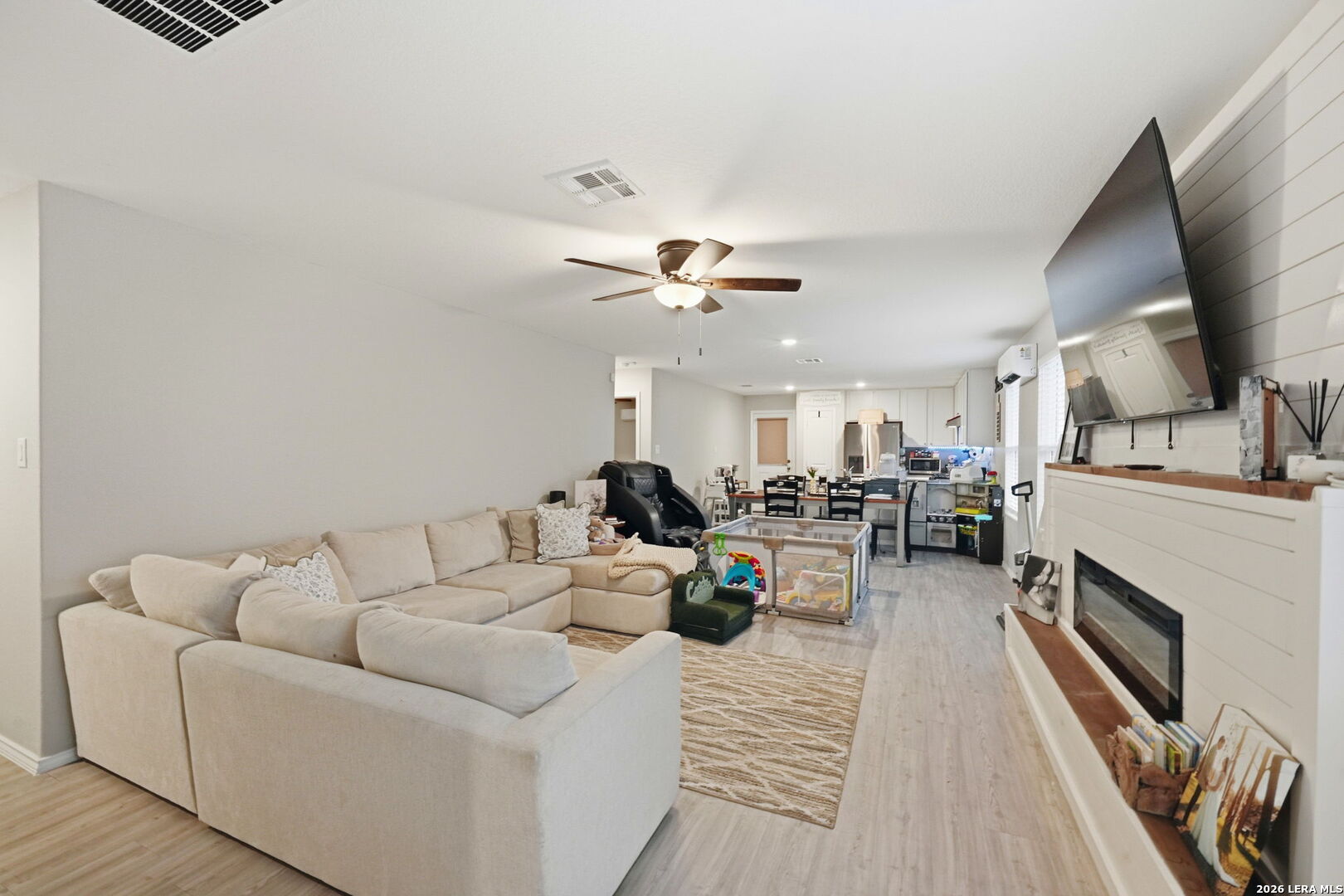 140 Maverick Cove Pleasanton, TX 78064 - Photo 3 of 26 a living room with furniture and a fireplace