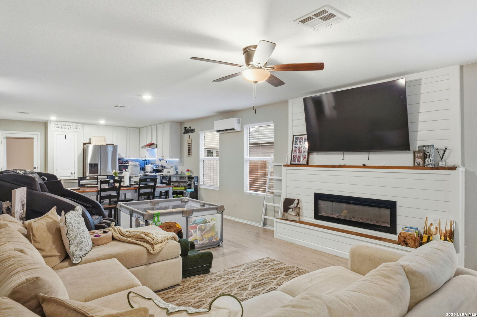 140 Maverick Cove Pleasanton, TX 78064 - Photo 5 of 26 a living room with fireplace furniture and a flat screen tv