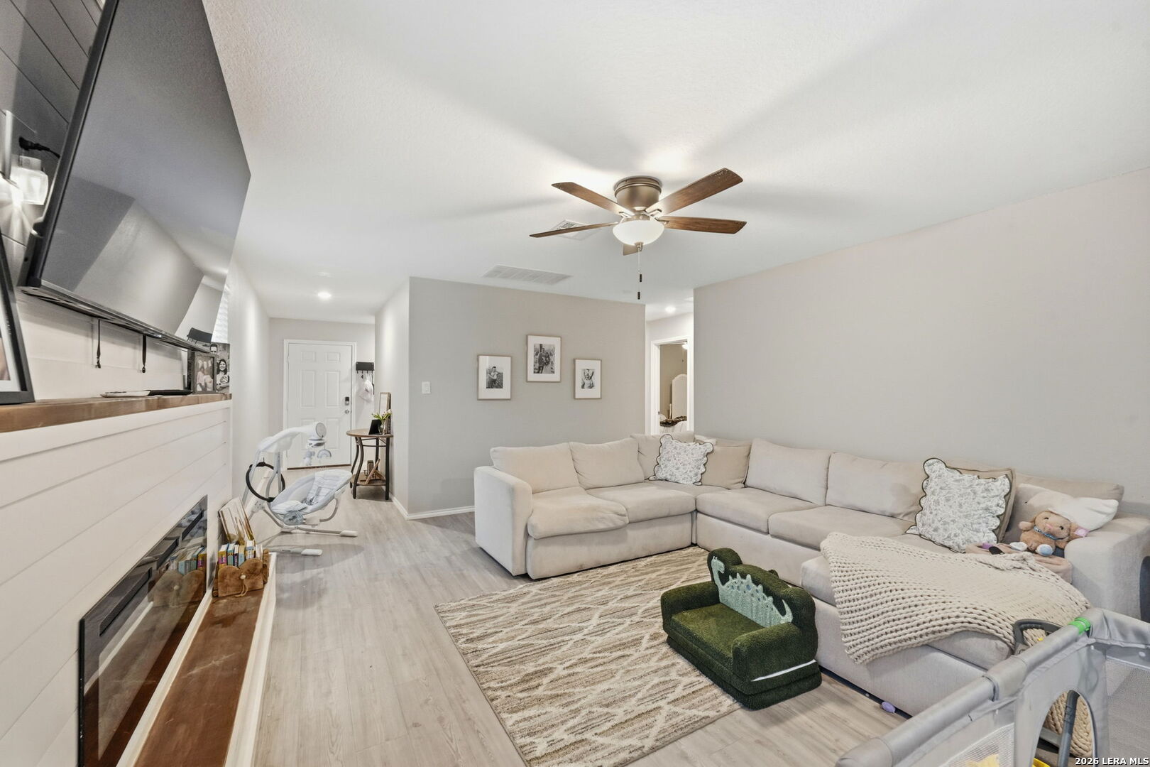 140 Maverick Cove Pleasanton, TX 78064 - Photo 7 of 26 a living room with furniture and a chandelier